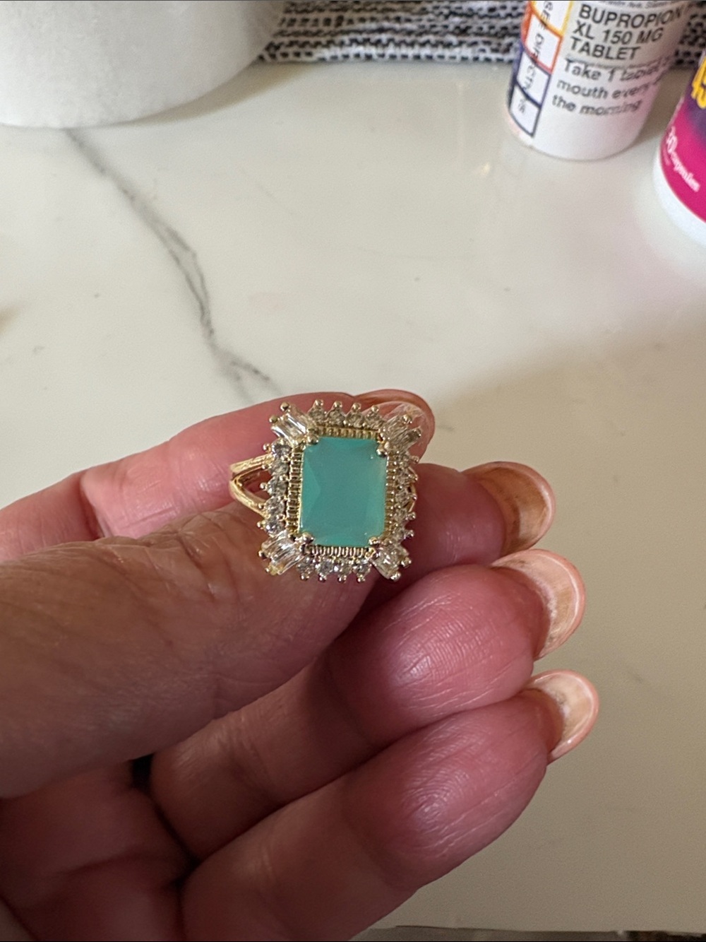 Gold Ring with Aqua Green Stone and Halo Accents